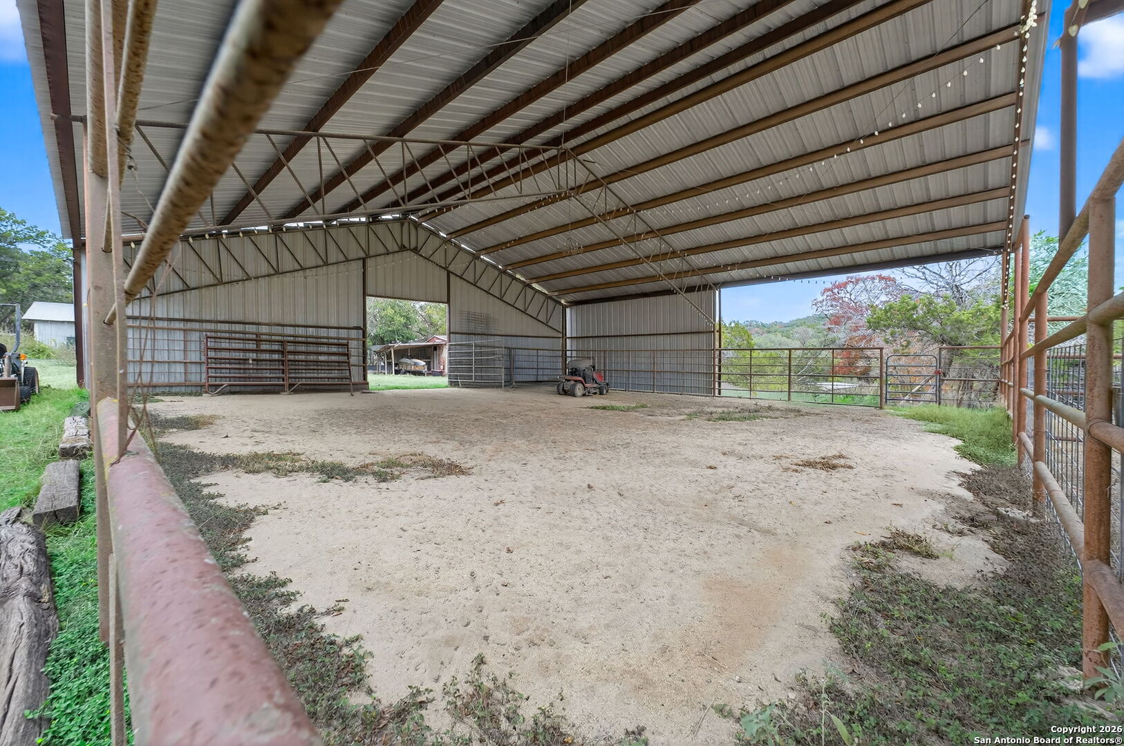 5 Cedar Ridge Road Boerne, TX 78006 - Photo 43 of 47 a view of a backyard with wooden fence and trees
