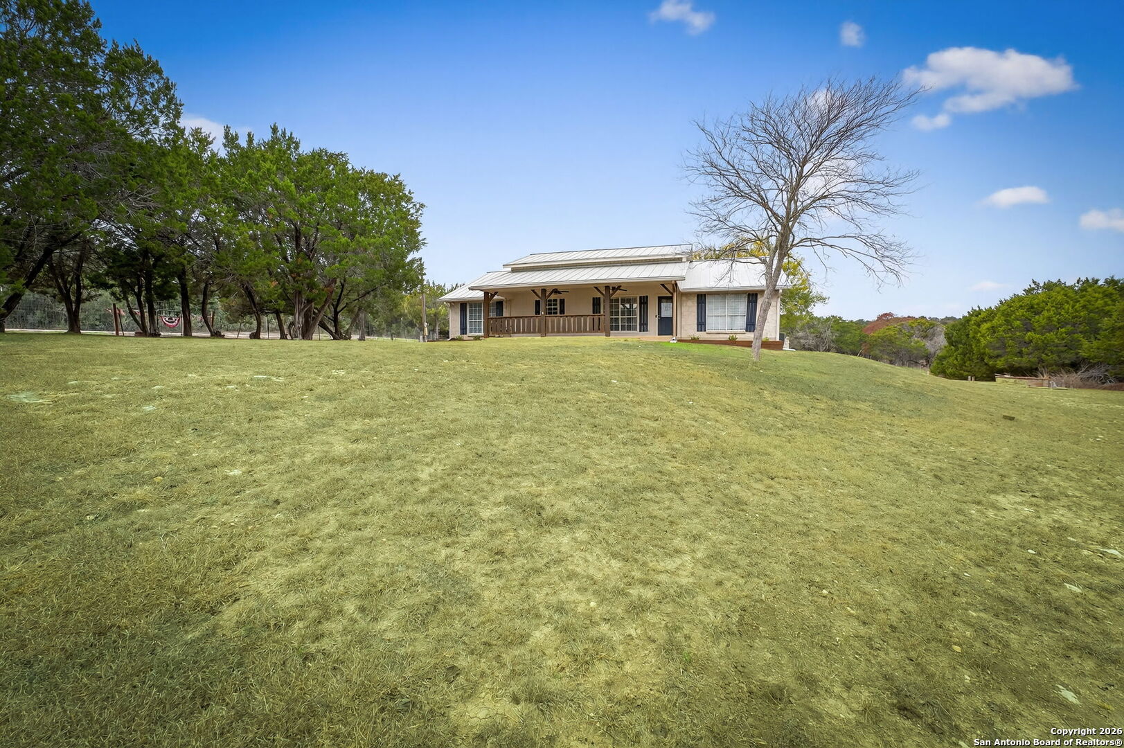 5 Cedar Ridge Road Boerne, TX 78006 - Photo 6 of 47 a front view of a house with a garden