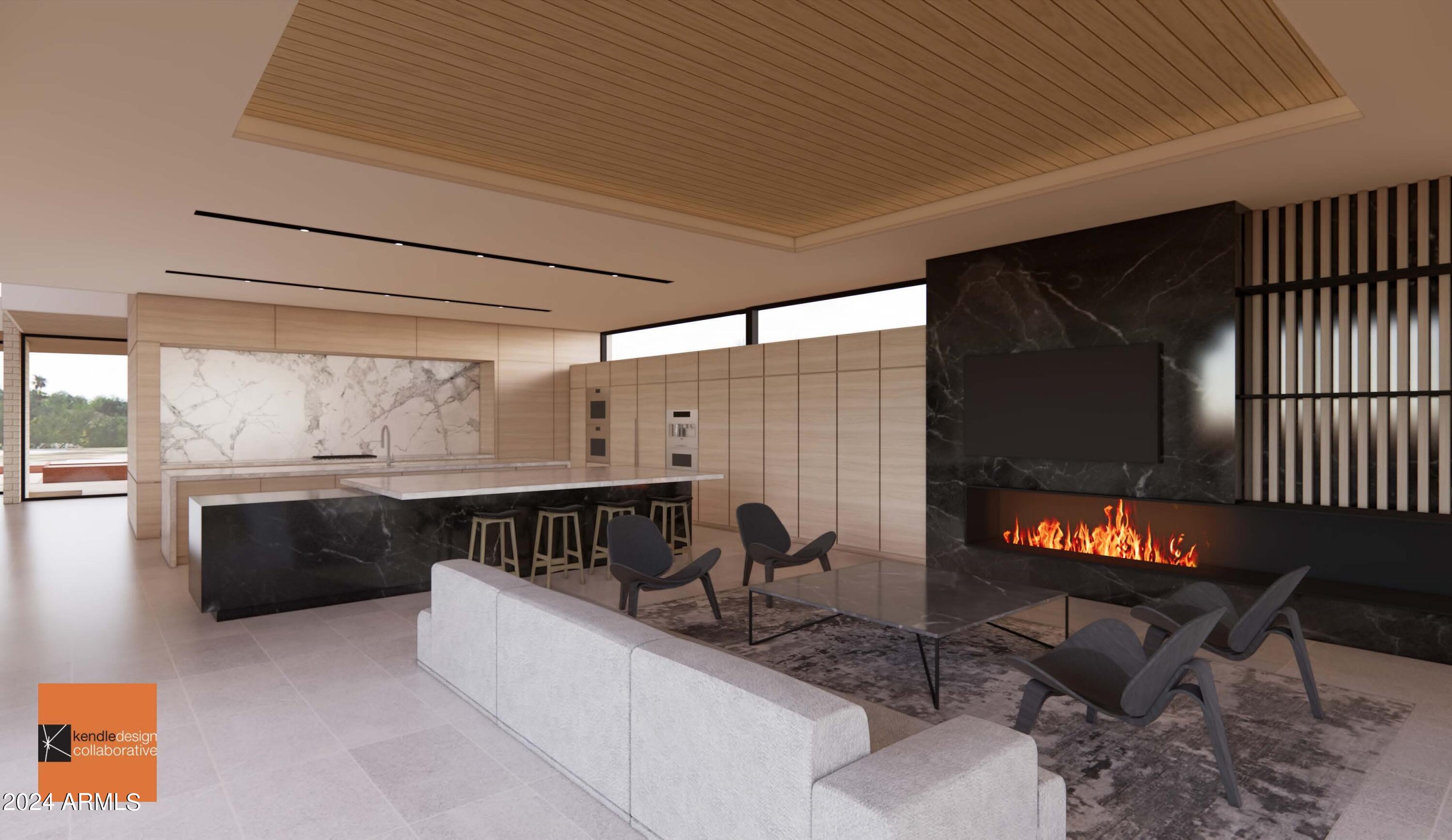 6612 East Hummingbird Lane Paradise Valley, AZ 85253 - Photo 11 of 16 a kitchen with granite countertop lots of counter top space and dining table