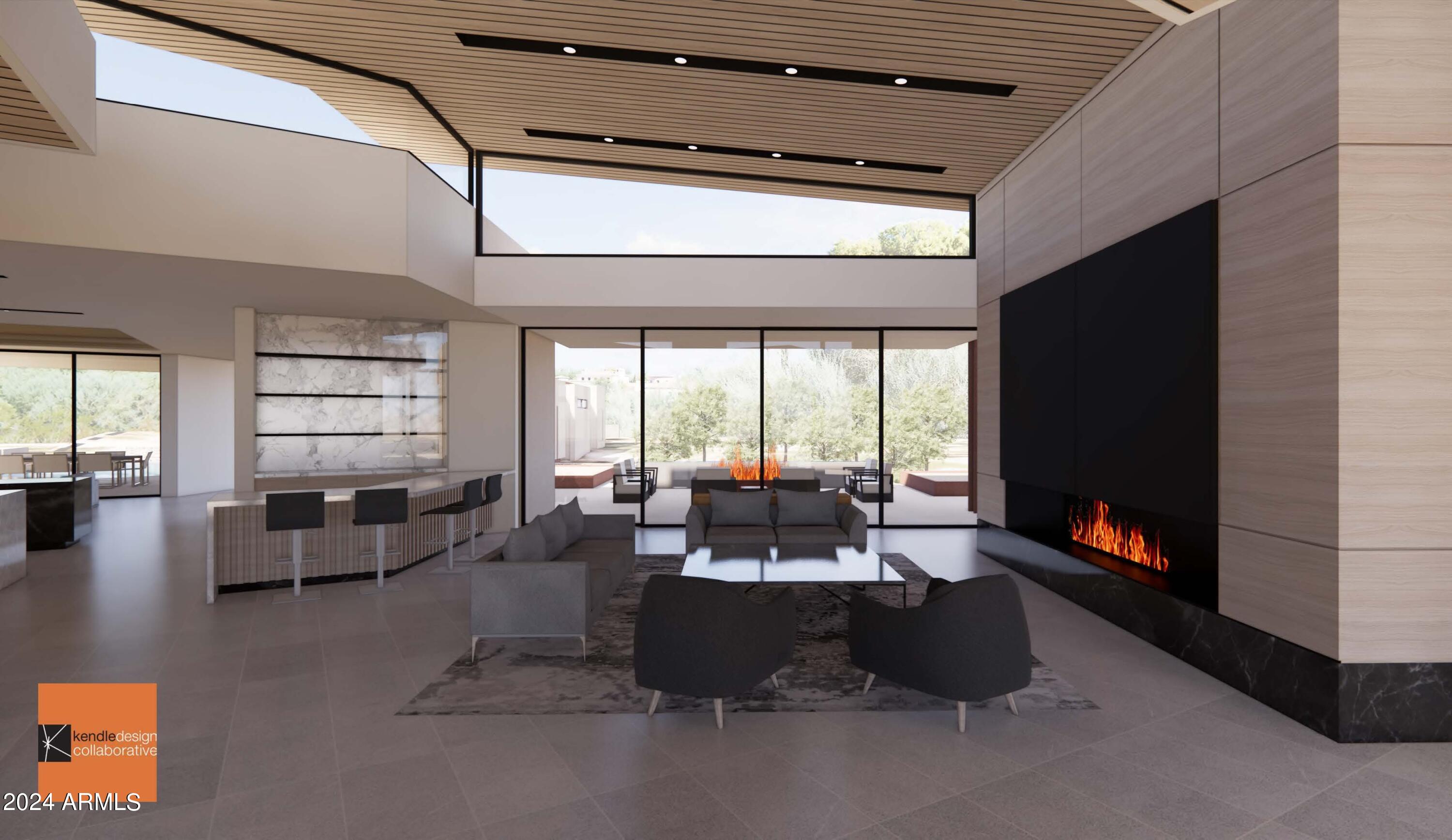 6612 East Hummingbird Lane Paradise Valley, AZ 85253 - Photo 4 of 16 a living room with furniture and a flat screen tv