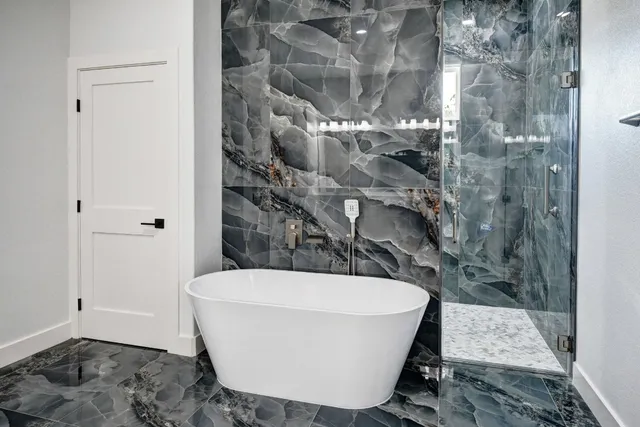 a white bath tub sitting in a bathroom