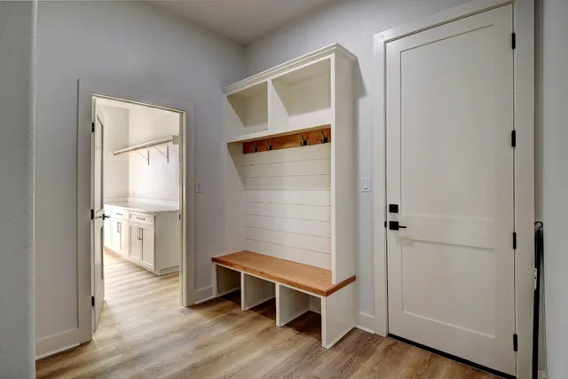 a view of an empty room and wooden floor