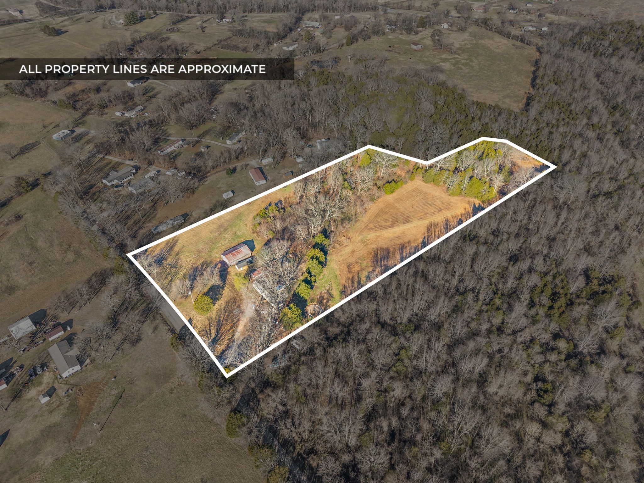 1061 Scott Road Bethpage, TN 37022 - Photo 2 of 32 a wooden bench in a backyard