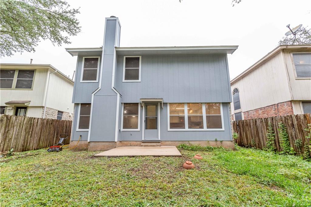 13207 Vendrell Drive Austin, TX 78729 - Photo 20 of 20 a front view of a house with a garden