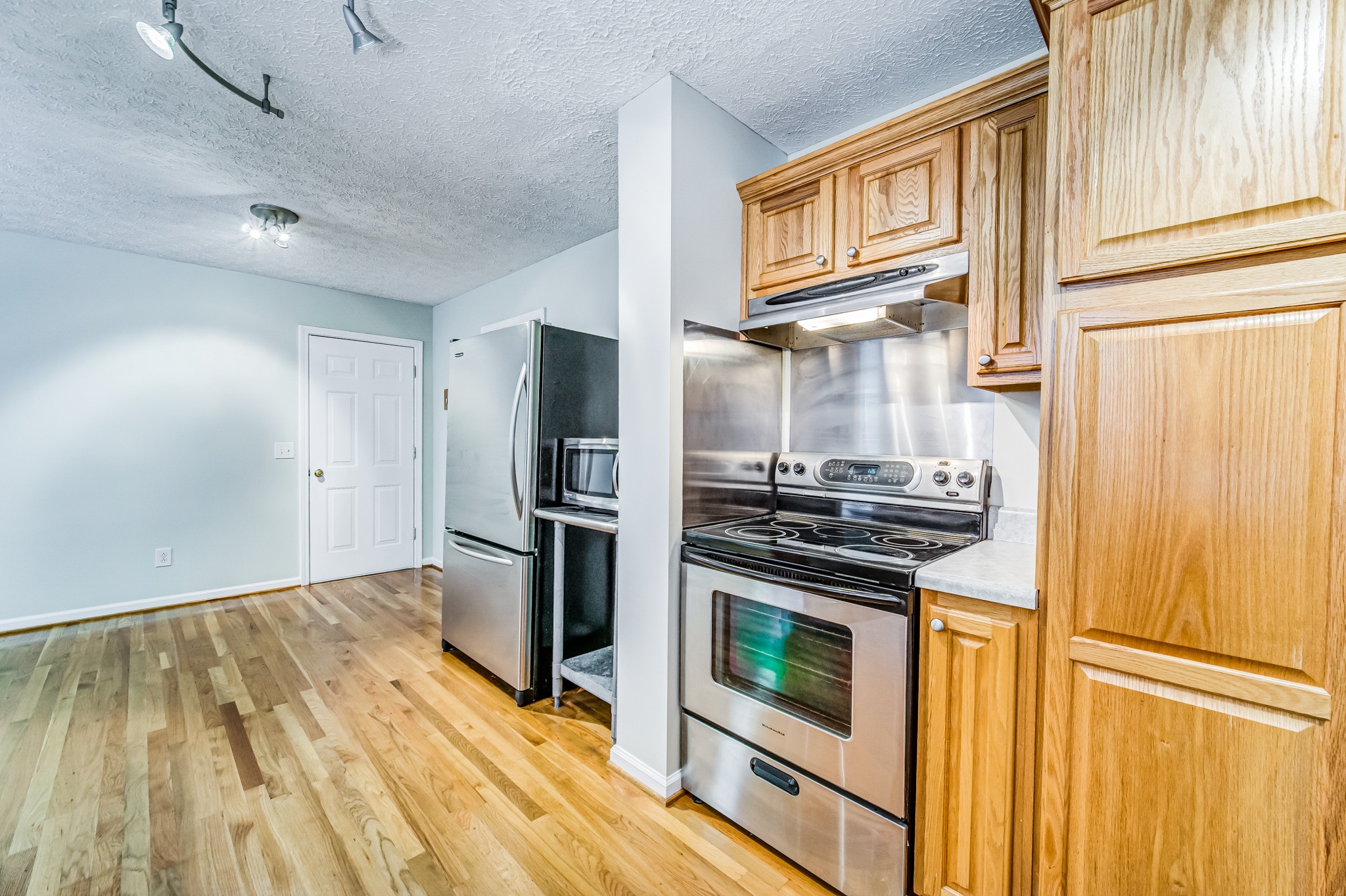 7583 Cherokee Hills Road Fairview, TN 37062 - Photo 24 of 50 a kitchen with a stove microwave and refrigerator