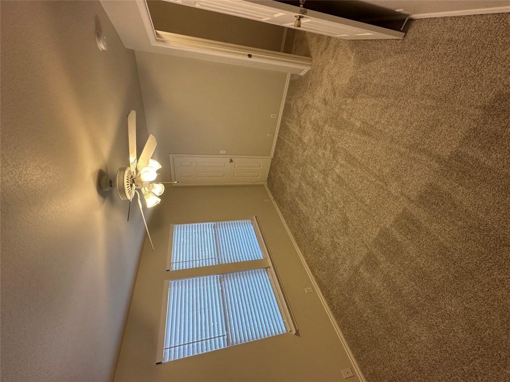 120 B Utterback Kyle, TX 78640 - Photo 11 of 24 an empty room with windows and fan