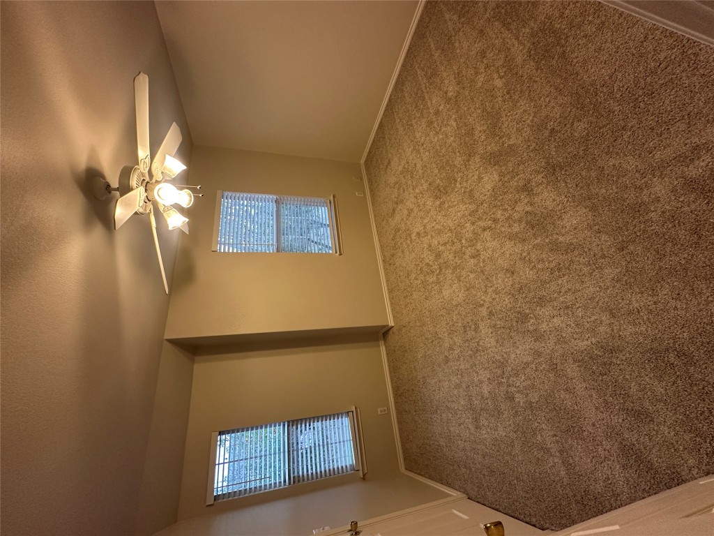 120 B Utterback Kyle, TX 78640 - Photo 13 of 24 an empty room with windows and fan