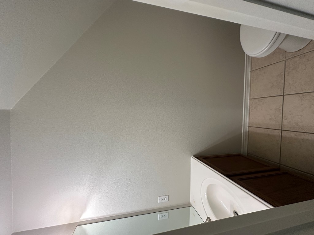 120 B Utterback Kyle, TX 78640 - Photo 17 of 24 a bathroom with a sink toilet and vanity