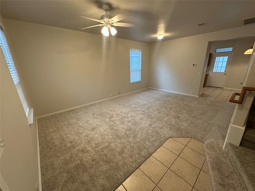 120 B Utterback Kyle, TX 78640 - Photo 6 of 24 an empty room with windows and fan