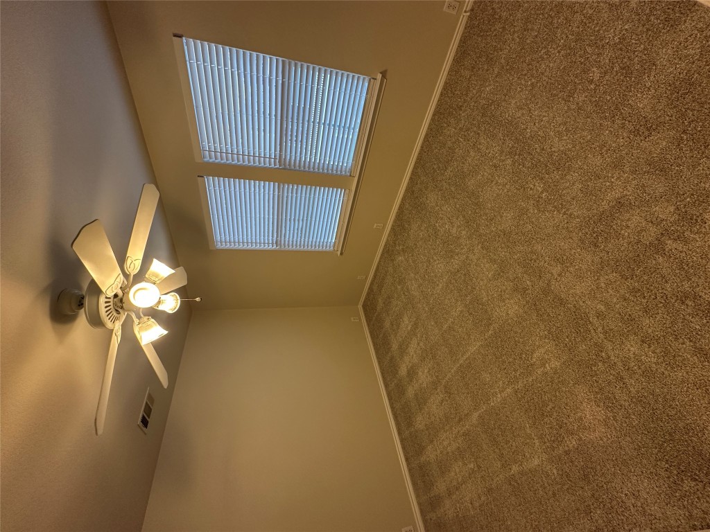 120 B Utterback Kyle, TX 78640 - Photo 10 of 24 a view of an empty room with a chandelier fan