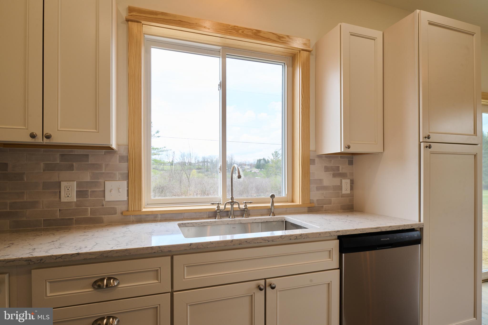 129 Lower Georges Valley Road Spring Mills, PA 16875 - Photo 13 of 61 a kitchen with stainless steel appliances granite countertop a sink a refrigerator and a window