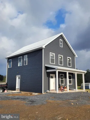 a front view of a house with a garage