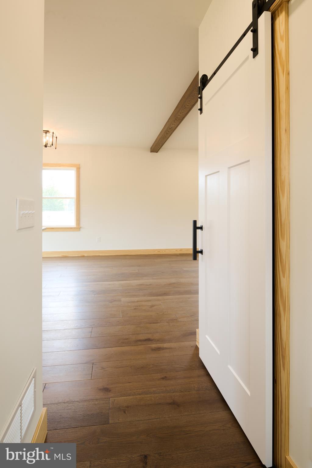 129 Lower Georges Valley Road Spring Mills, PA 16875 - Photo 23 of 61 a view of a room with wooden floor and windows