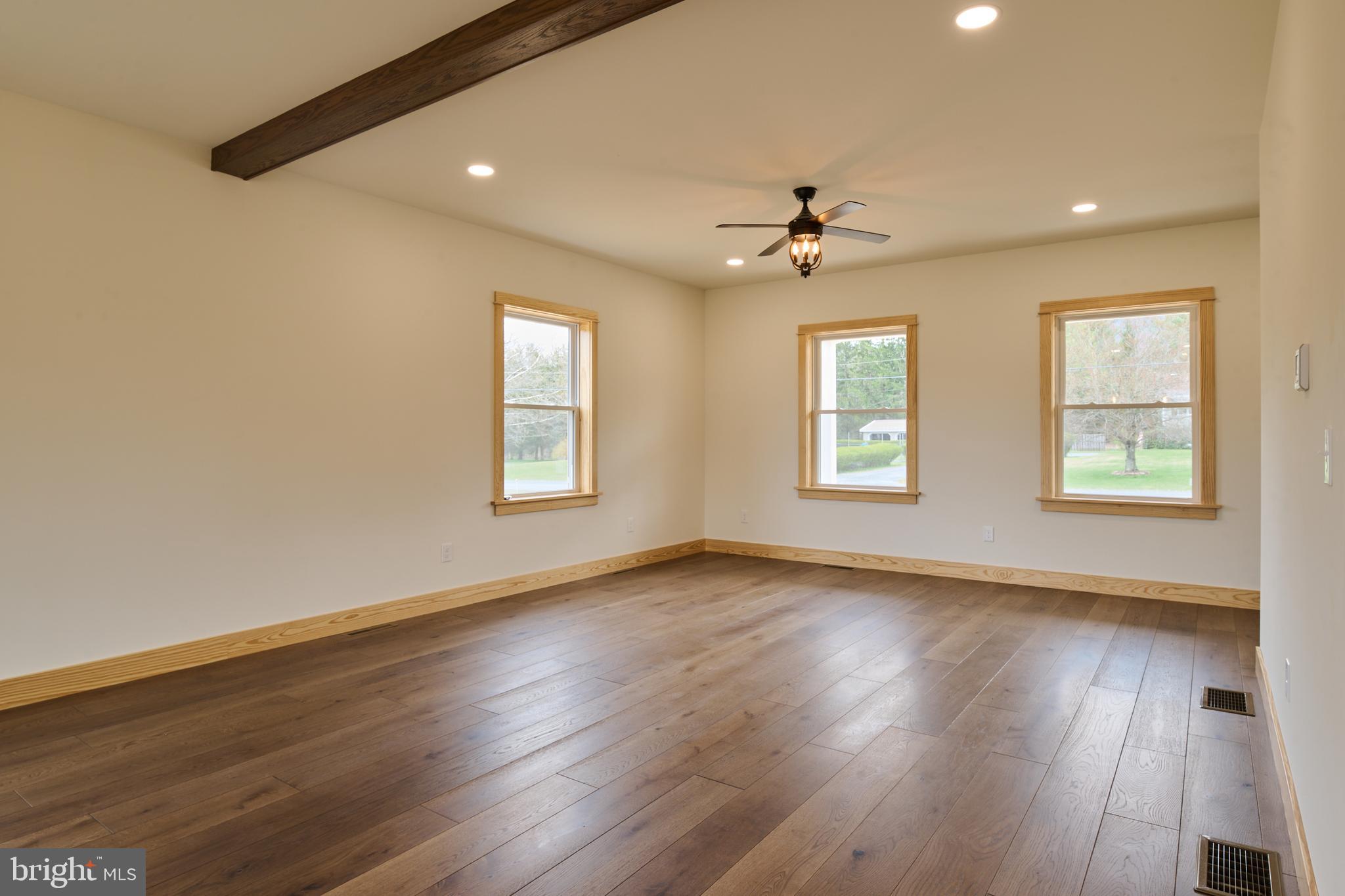 129 Lower Georges Valley Road Spring Mills, PA 16875 - Photo 25 of 61 a view of an empty room with wooden floor and a window