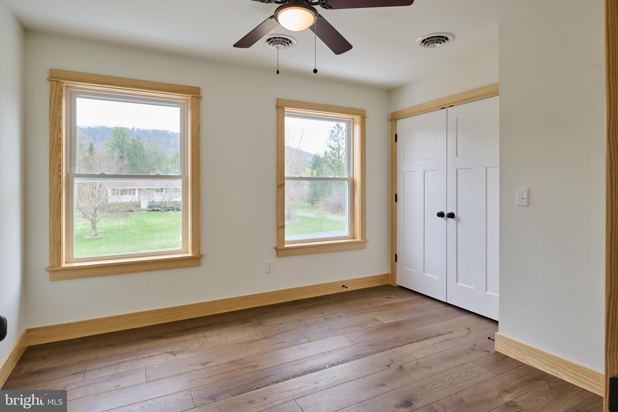 129 Lower Georges Valley Road Spring Mills, PA 16875 - Photo 29 of 61 a view of an empty room with wooden floor and a window