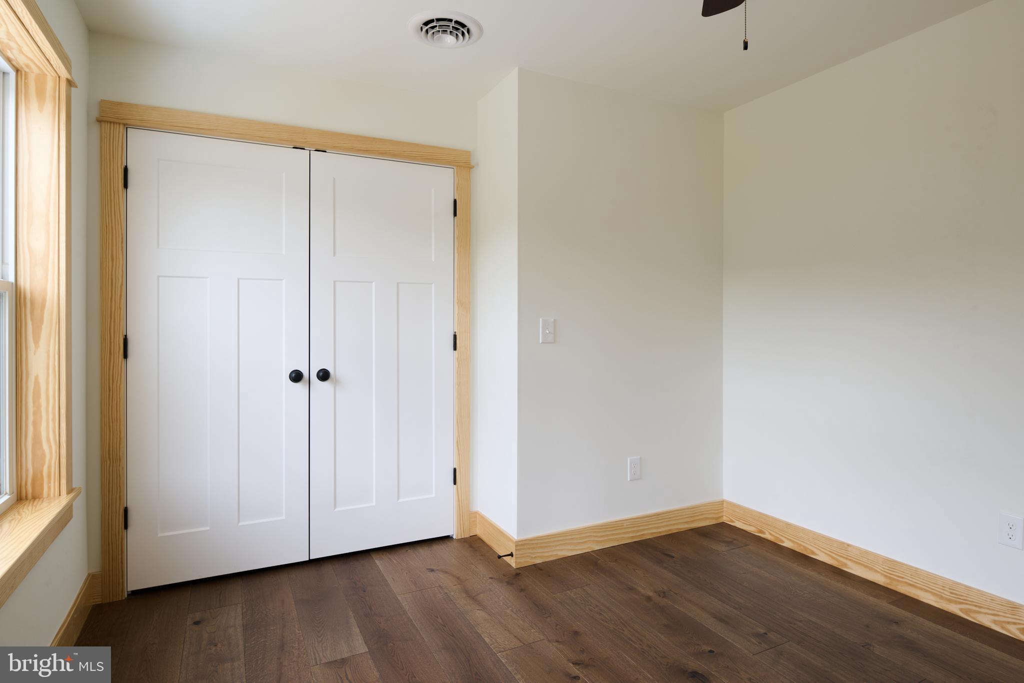 129 Lower Georges Valley Road Spring Mills, PA 16875 - Photo 30 of 61 a view of an empty room with wooden floor and closet