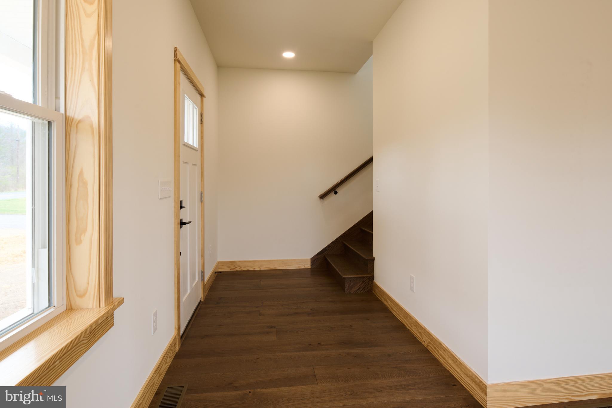129 Lower Georges Valley Road Spring Mills, PA 16875 - Photo 3 of 61 a view of a hallway with wooden floor and staircase