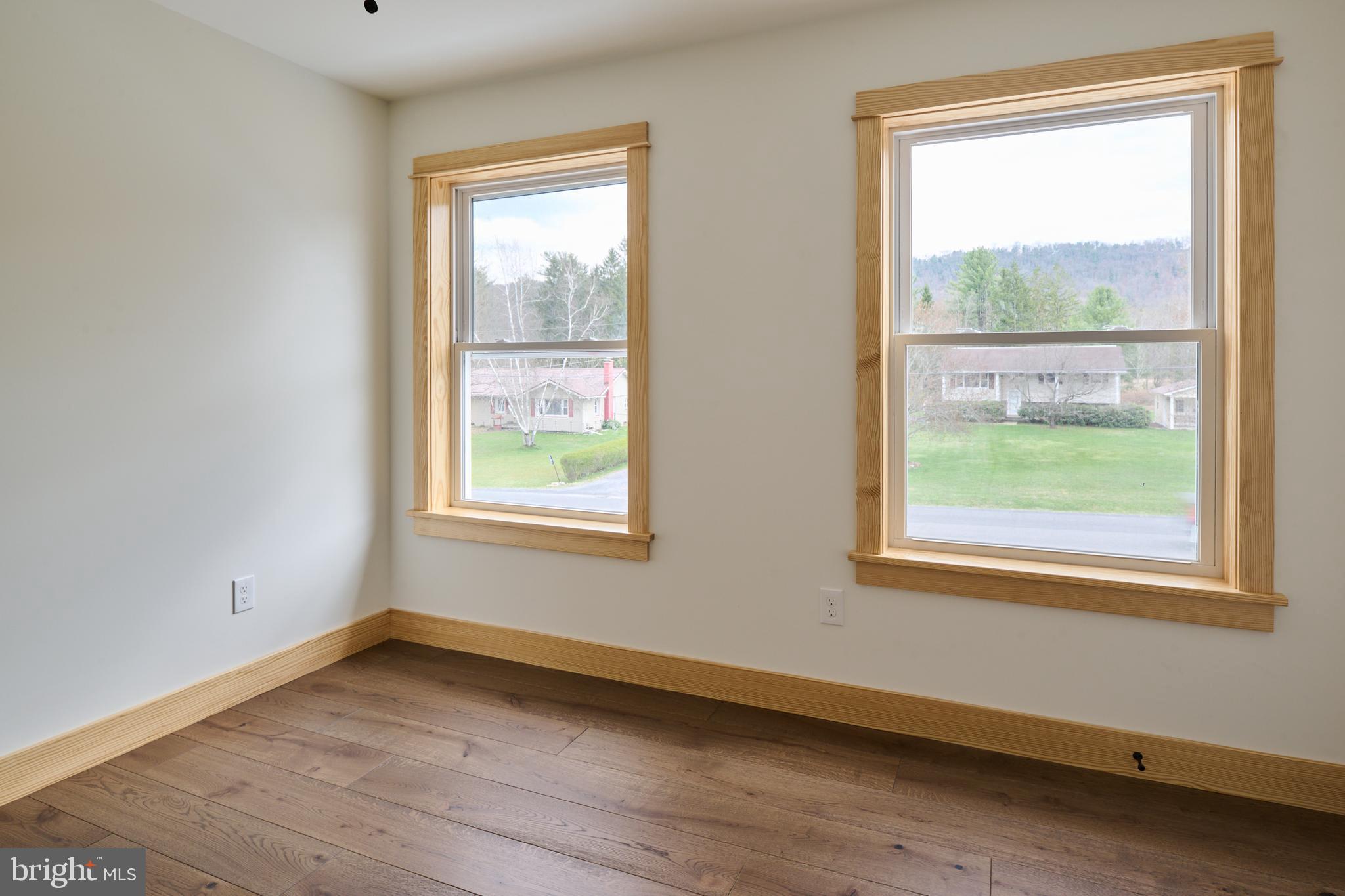129 Lower Georges Valley Road Spring Mills, PA 16875 - Photo 32 of 61 a view of an empty room with wooden floor and a window