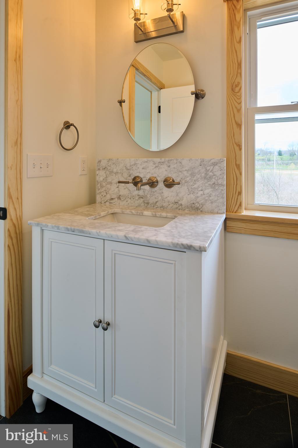 129 Lower Georges Valley Road Spring Mills, PA 16875 - Photo 50 of 61 a bathroom with a granite countertop sink and mirror