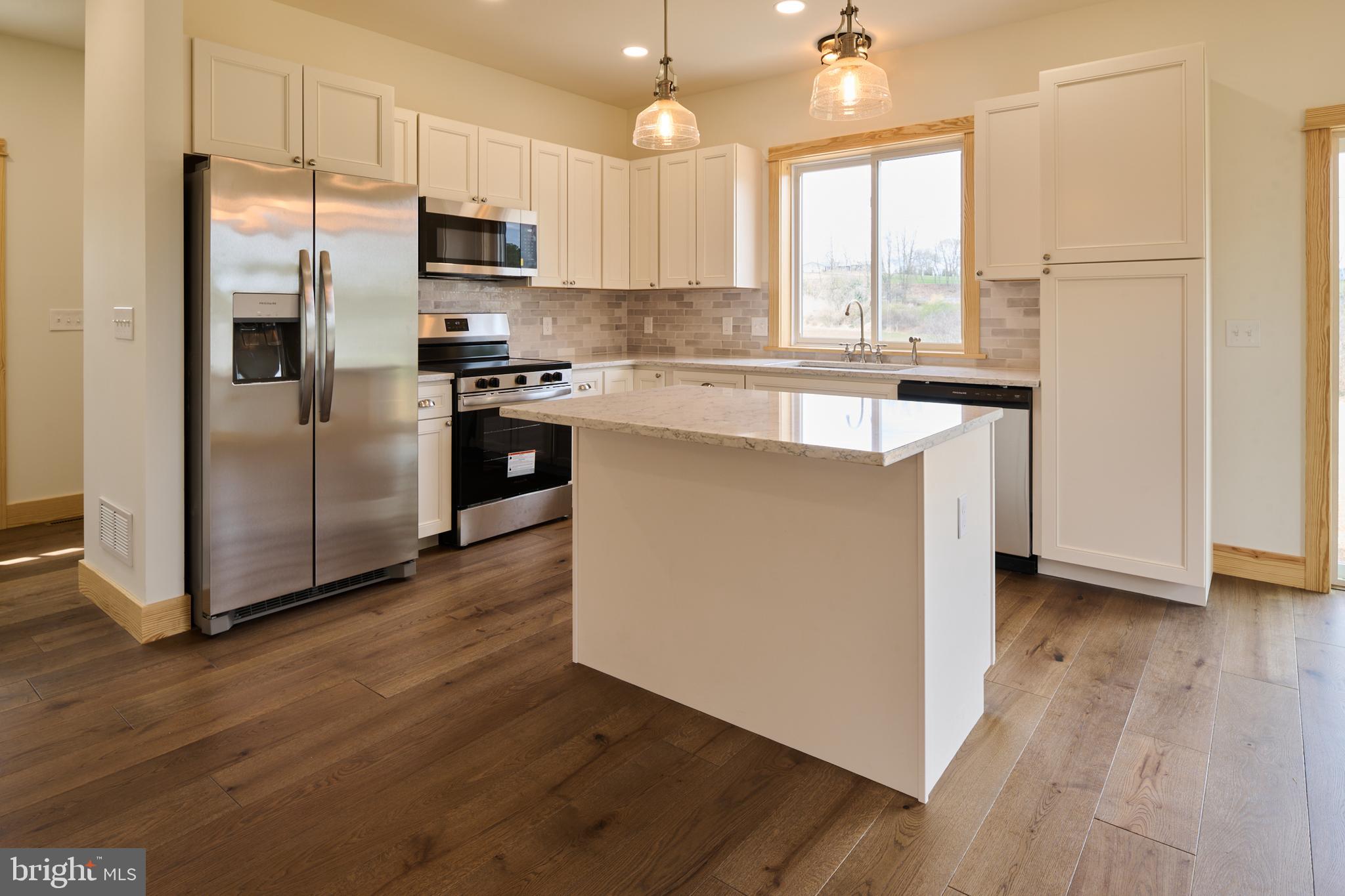 129 Lower Georges Valley Road Spring Mills, PA 16875 - Photo 6 of 61 a kitchen with stainless steel appliances a refrigerator sink and microwave