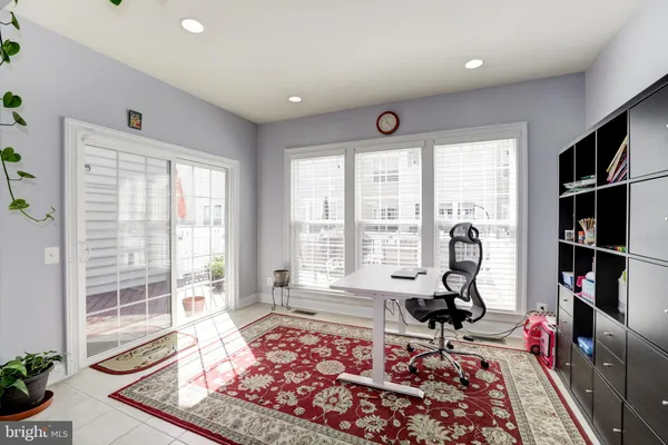 a living room with furniture and a rug