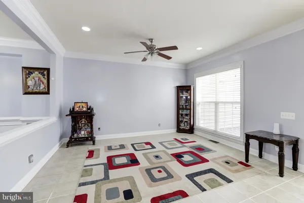 a bedroom with furniture and a baby crib