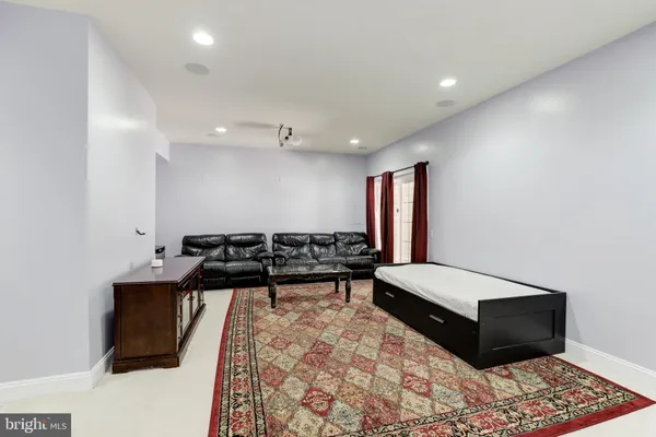 a living room with a couch and a rug