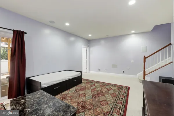 a spacious bathroom with a bathtub and a large mirror
