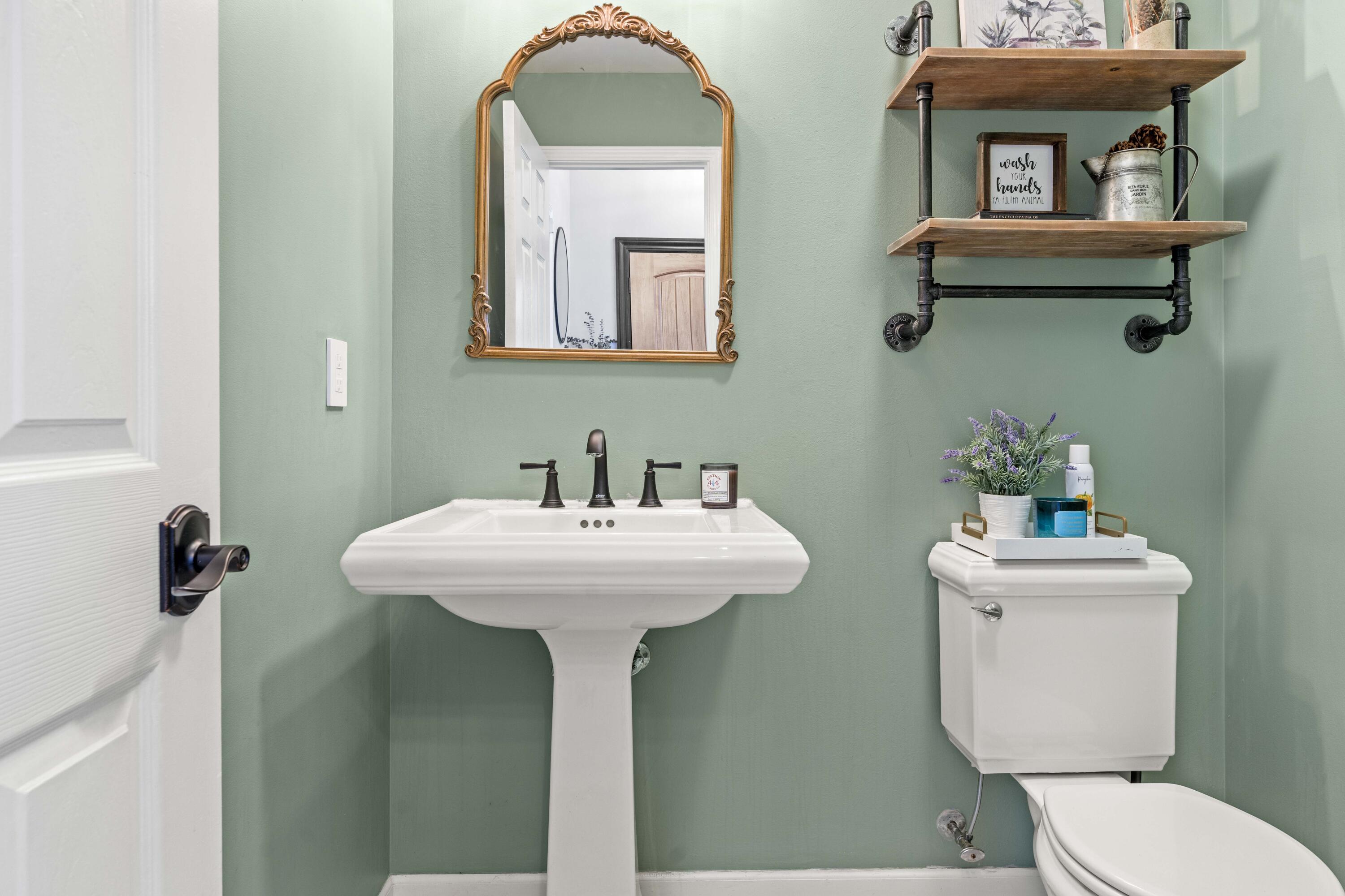 12025 Heron Lake Road St. John, IN 46373 - Photo 11 of 42 a bathroom with a toilet sink and mirror