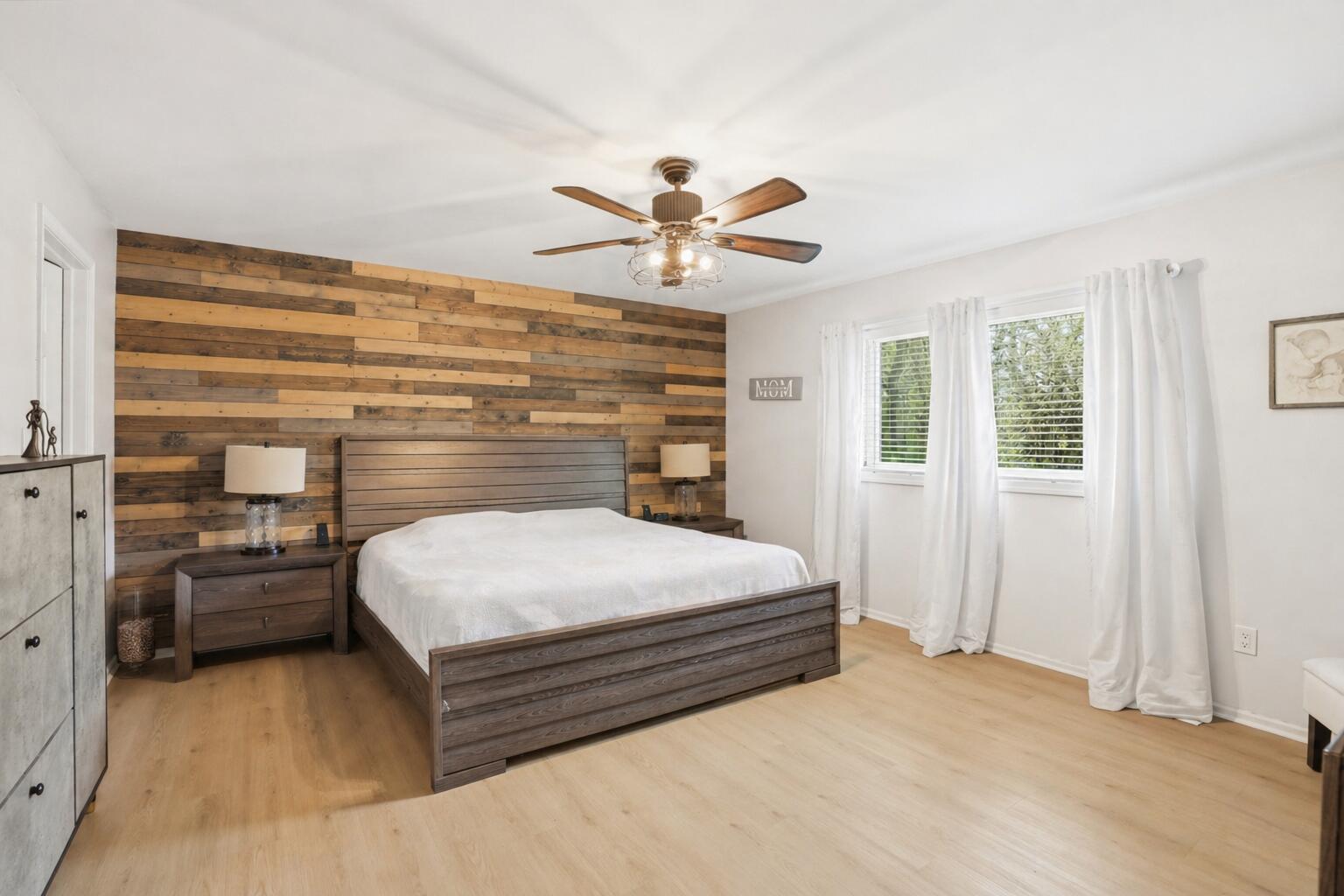 12025 Heron Lake Road St. John, IN 46373 - Photo 16 of 42 a bedroom with a bed and a chandelier