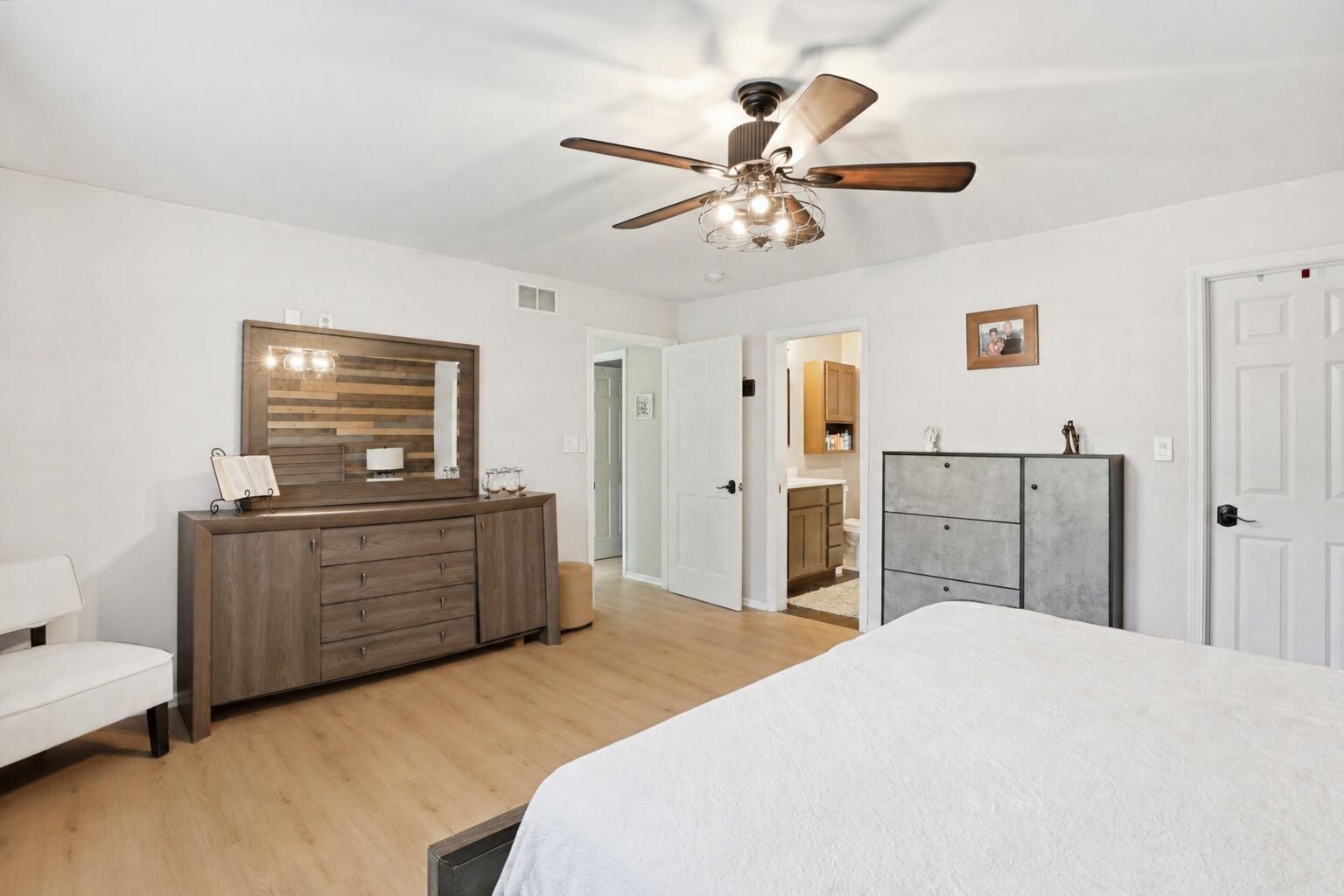 12025 Heron Lake Road St. John, IN 46373 - Photo 17 of 42 a bedroom with a bed and a chandelier
