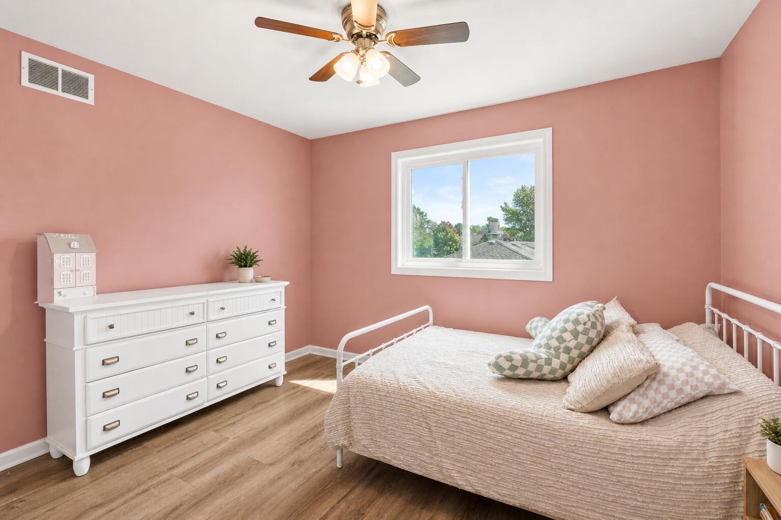 12025 Heron Lake Road St. John, IN 46373 - Photo 22 of 42 a bedroom with a bed and a window
