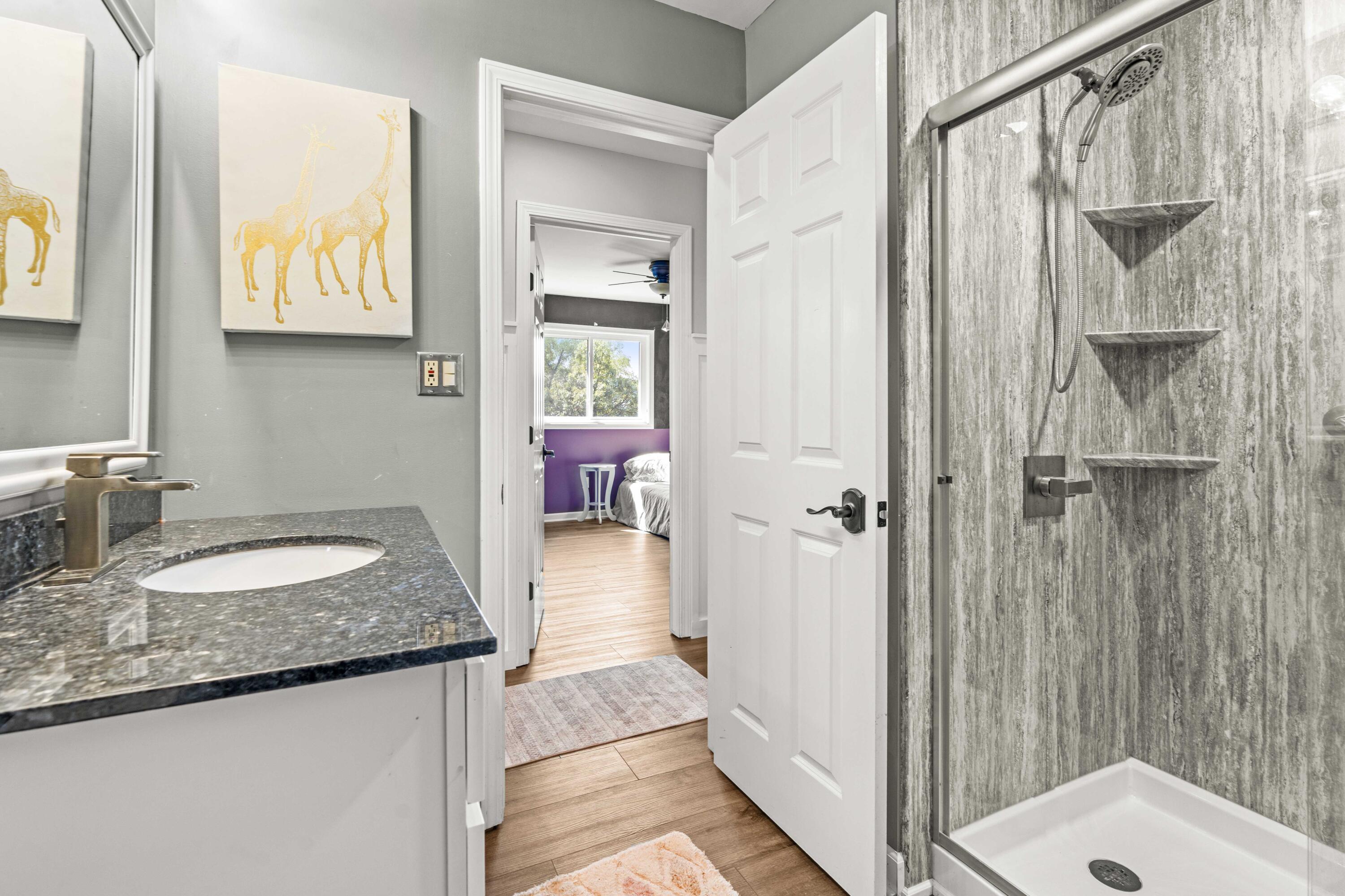 12025 Heron Lake Road St. John, IN 46373 - Photo 25 of 42 a bathroom with a granite countertop sink and a mirror