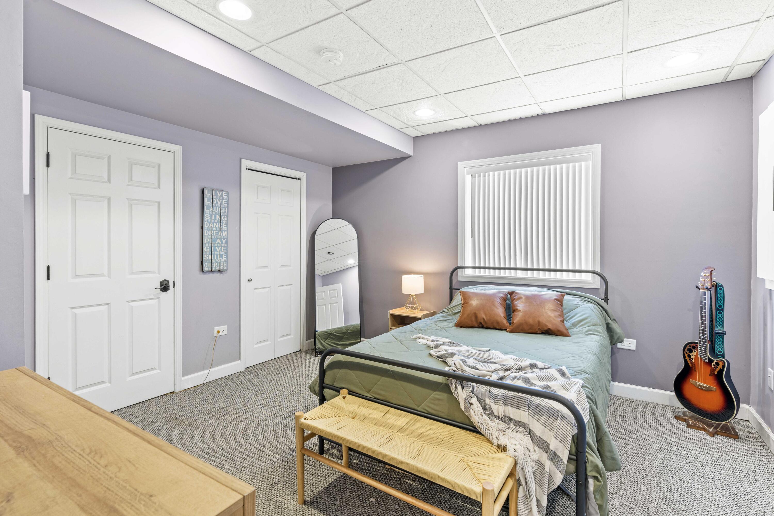 12025 Heron Lake Road St. John, IN 46373 - Photo 30 of 42 a bedroom with a bed and painting on the wall