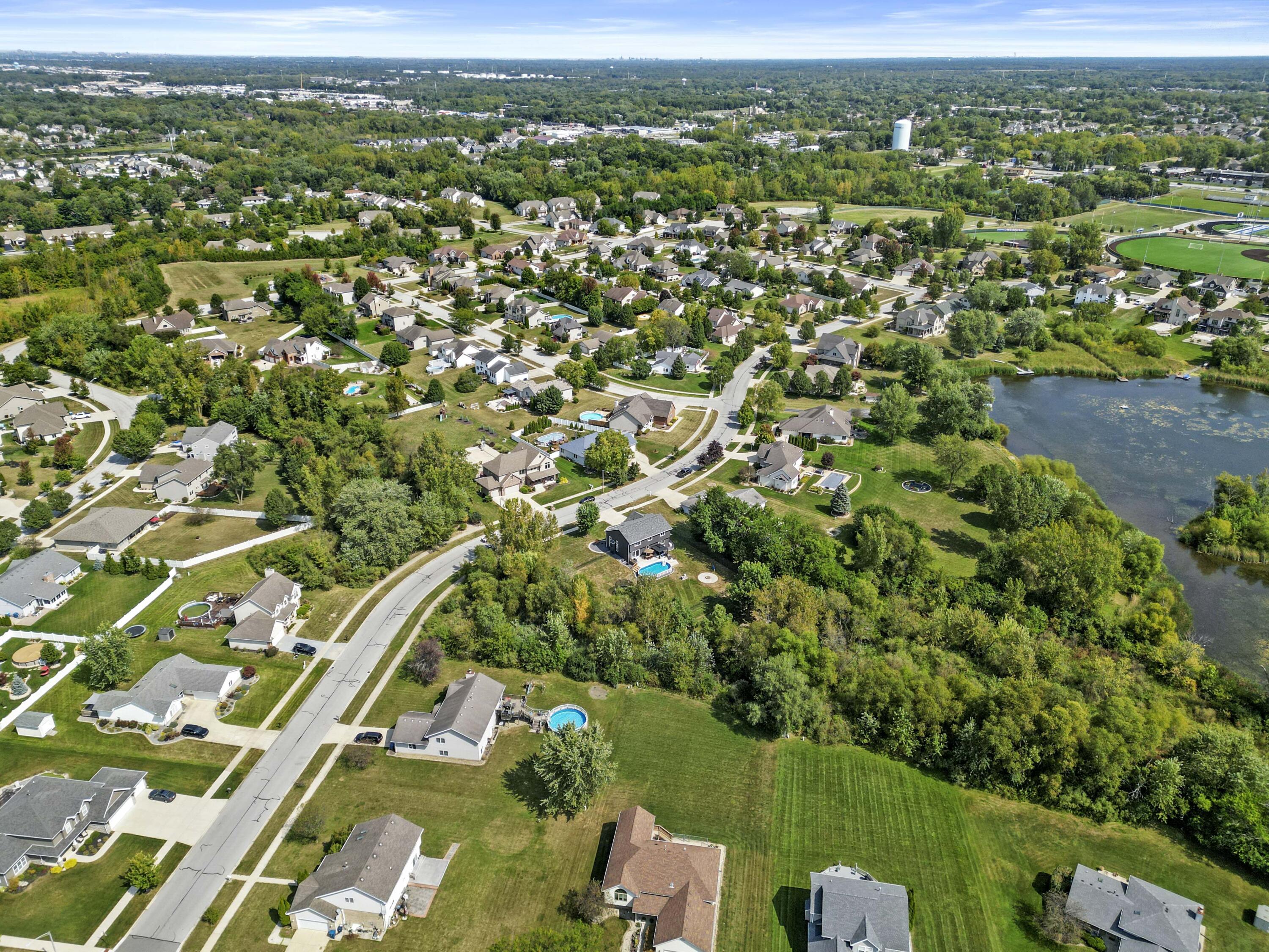 12025 Heron Lake Road St. John, IN 46373 - Photo 37 of 42 an aerial view of residential houses with outdoor space and trees
