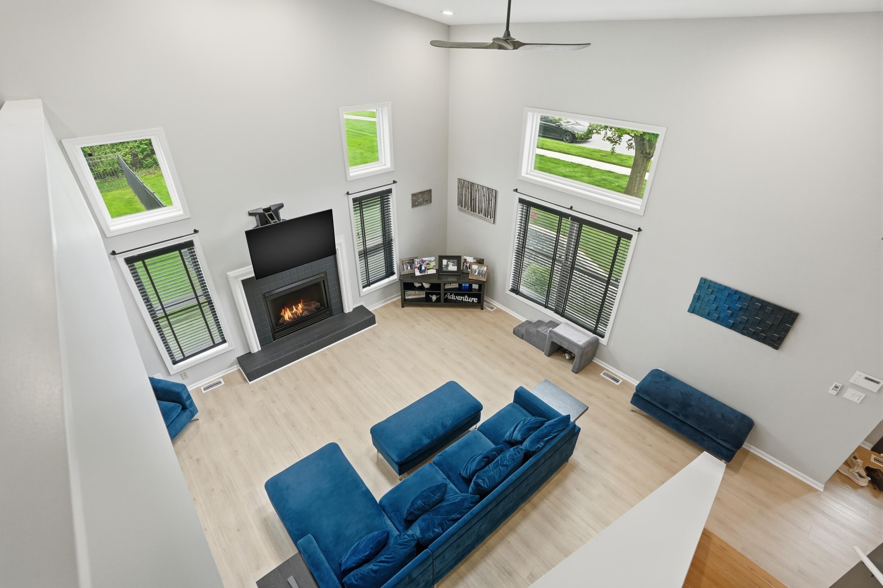 12025 Heron Lake Road St. John, IN 46373 - Photo 10 of 42 a living room with furniture and a fireplace