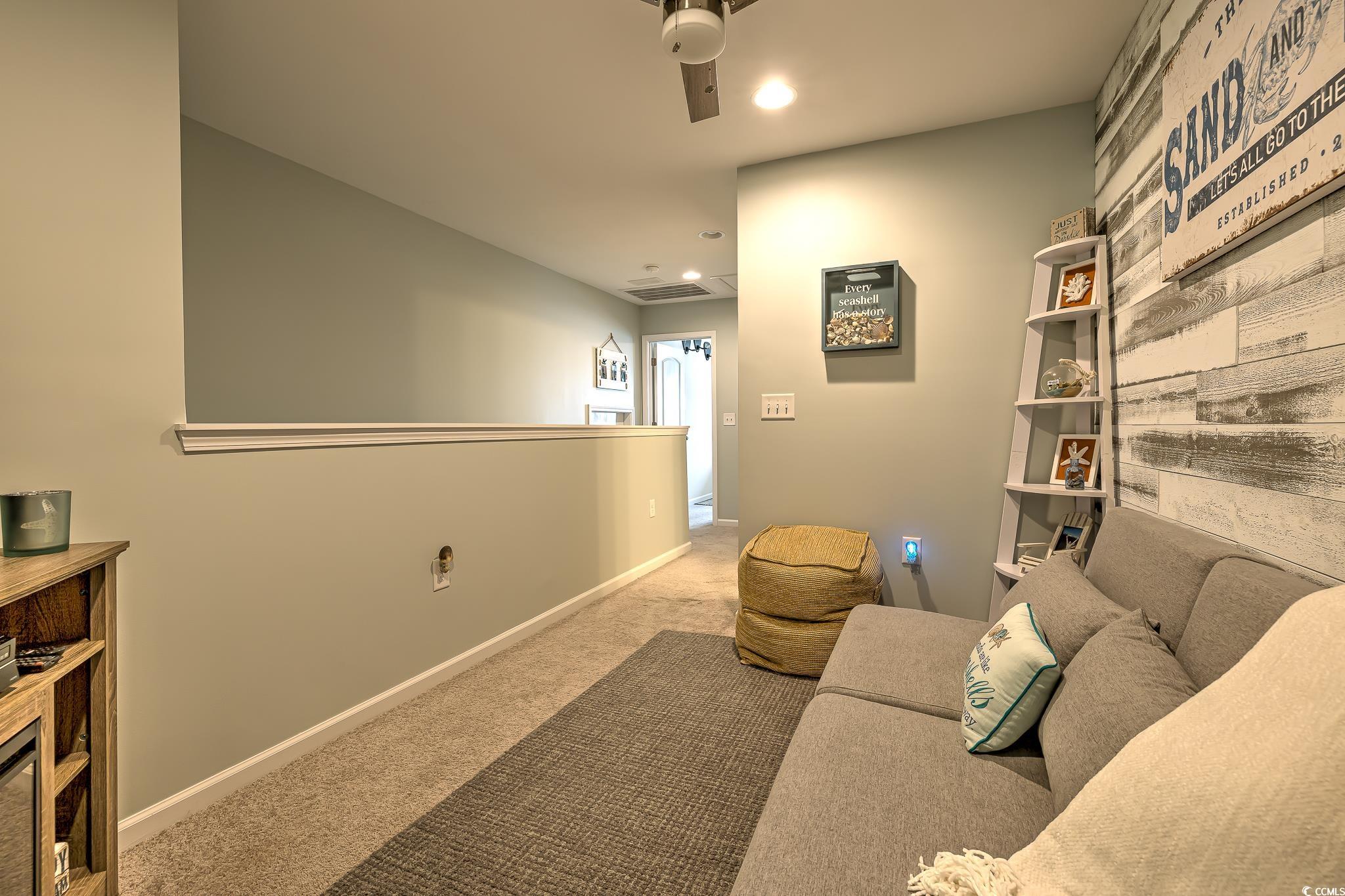 124 D Machrie Loop, Unit D Myrtle Beach, SC 29588 - Photo 23 of 37 View of carpeted bedroom