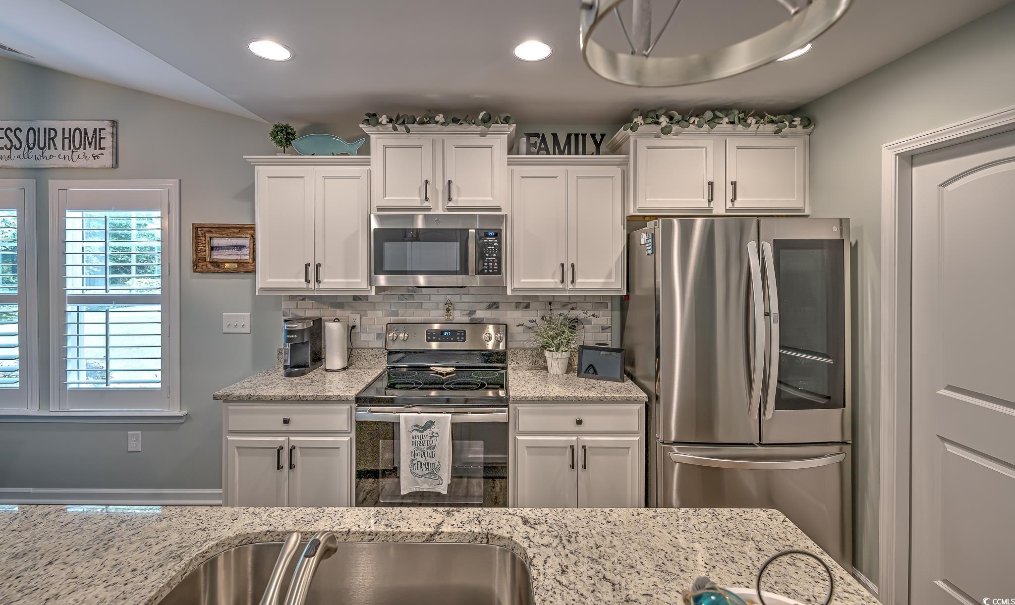 124 D Machrie Loop, Unit D Myrtle Beach, SC 29588 - Photo 5 of 37 Kitchen with appliances with stainless steel finis