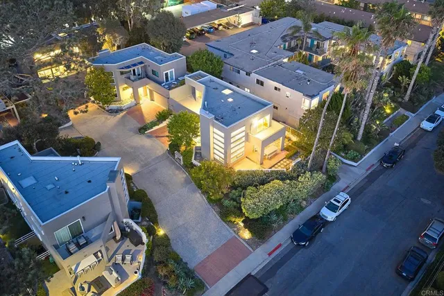 an aerial view of residential houses with outdoor space