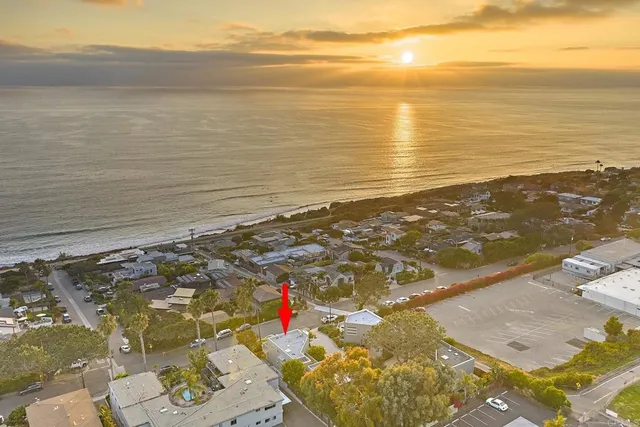 a view of an ocean and a mountain