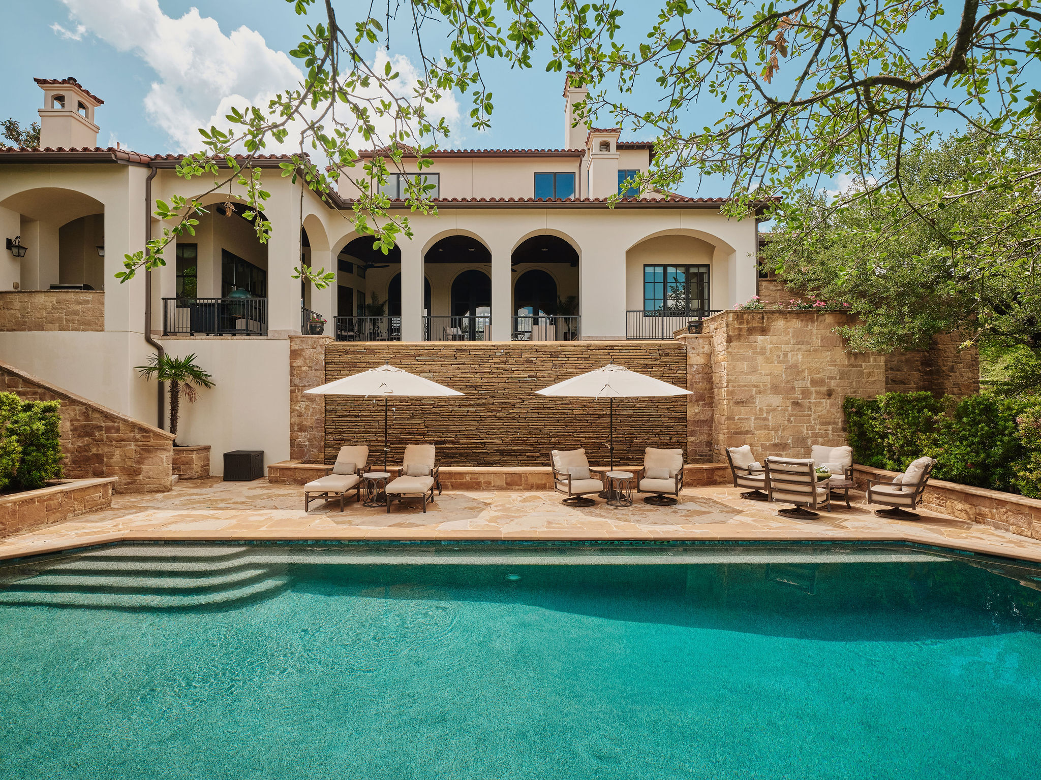 433 Brandon Way Austin, TX 78733 - Photo 26 of 40 A tiered outdoor oasis featuring a private pool and elegant architectural design.
