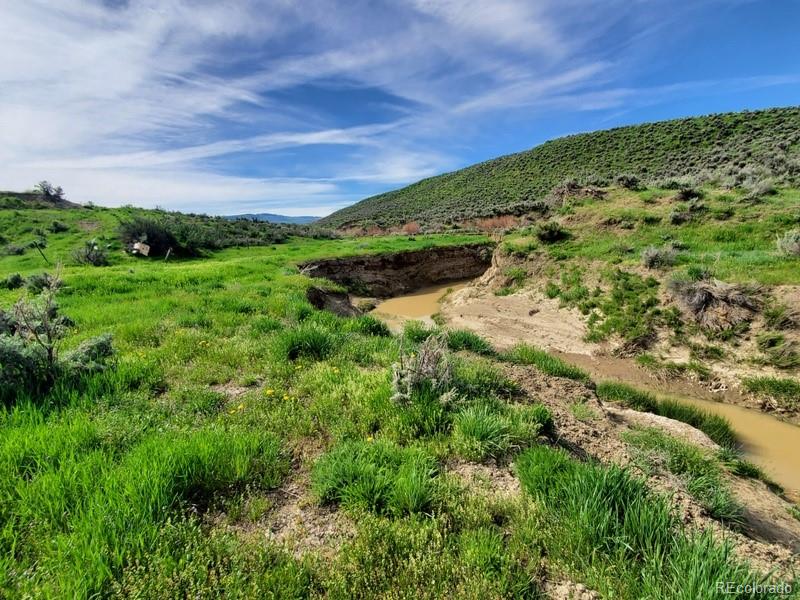 45 County Road Hamilton, CO 81638 - Photo 2 of 11 a view of a field with an ocean