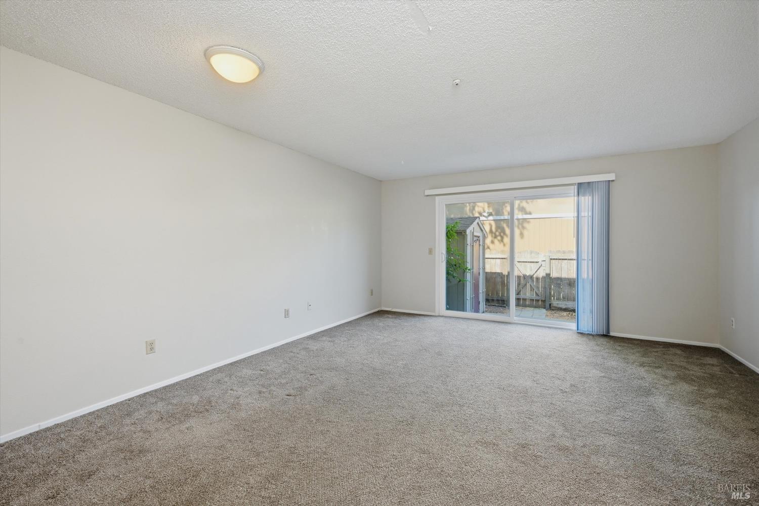 498 Santa Alicia Drive Rohnert Park, CA 94928 - Photo 8 of 18 an empty room with windows