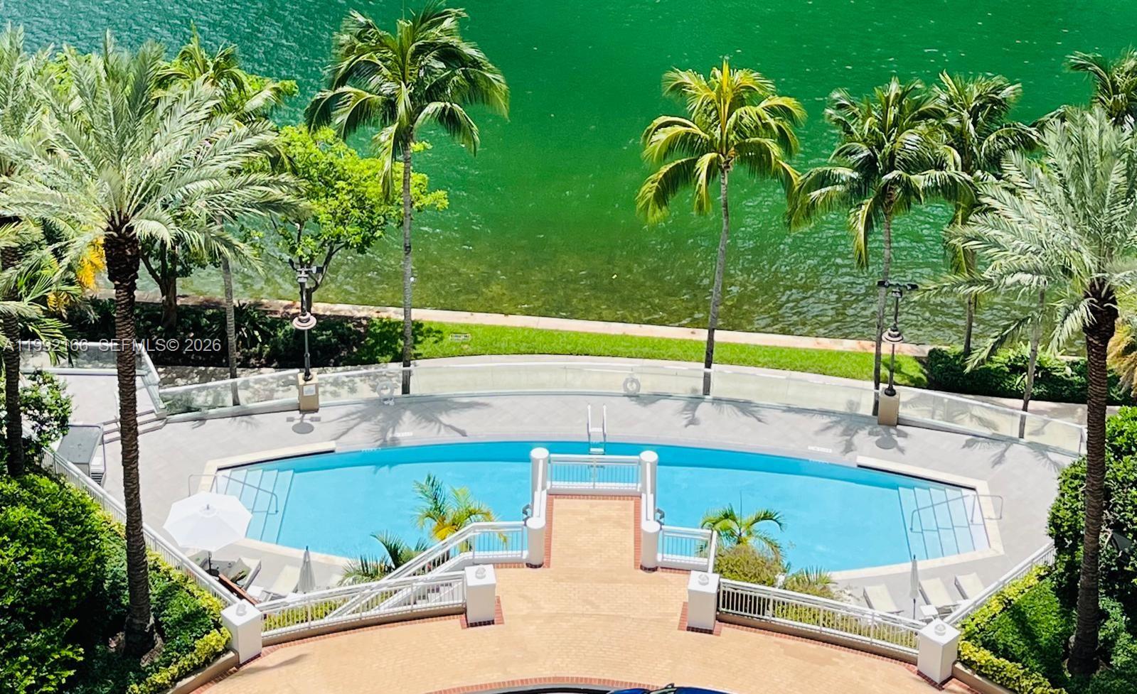 901 Brickell Key Boulevard, Unit 1609 Miami, FL 33131 - Photo 28 of 35 a view of a swimming pool with a patio