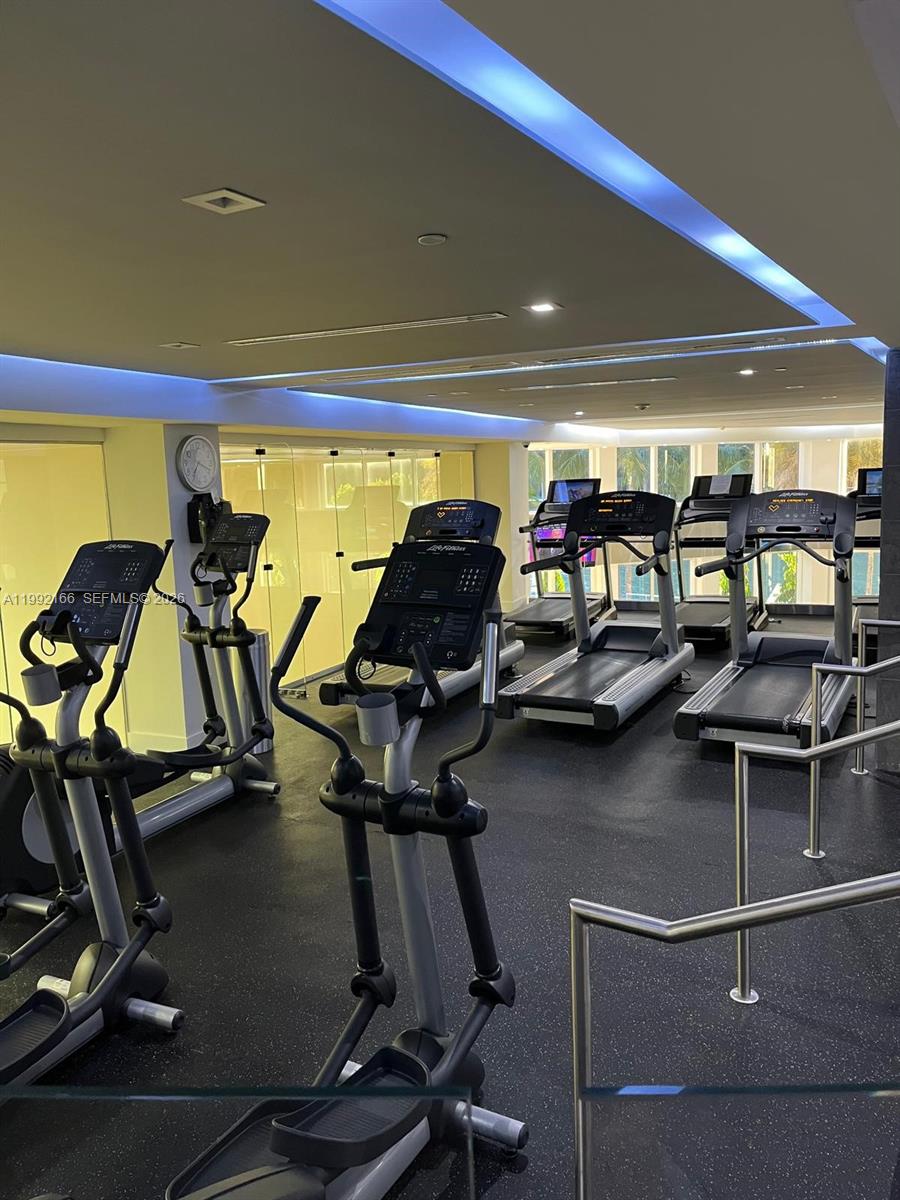 901 Brickell Key Boulevard, Unit 1609 Miami, FL 33131 - Photo 31 of 35 a room with gym equipment