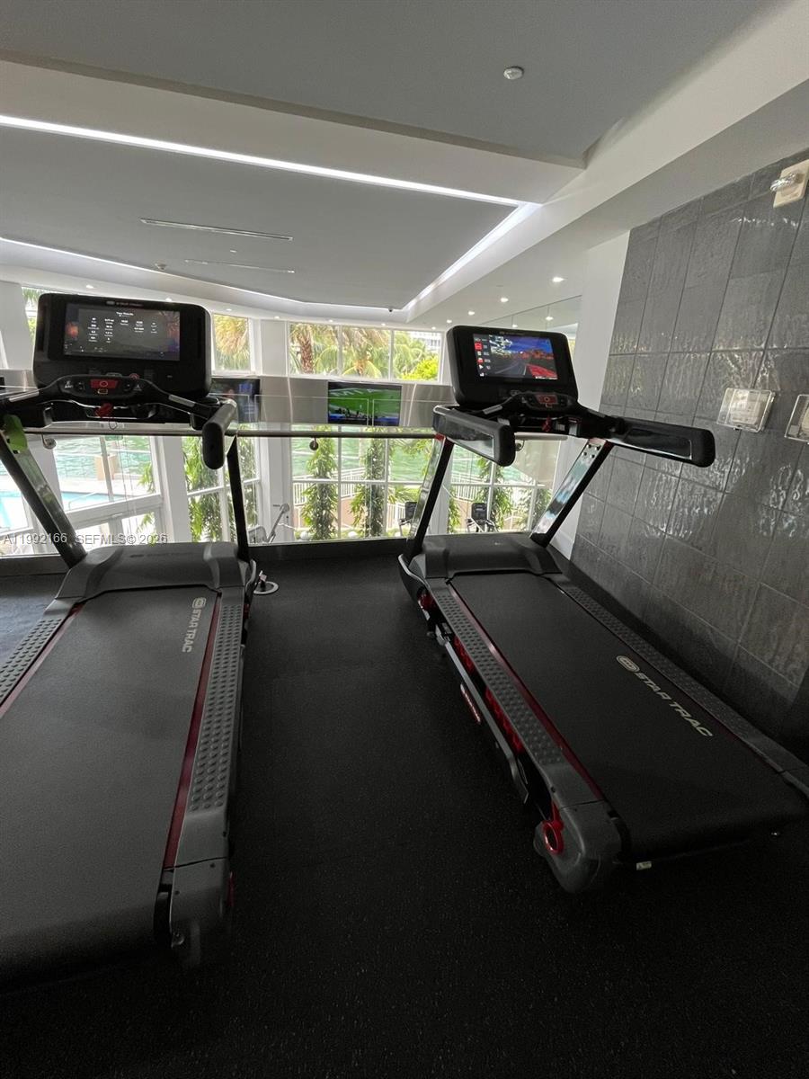 901 Brickell Key Boulevard, Unit 1609 Miami, FL 33131 - Photo 35 of 35 a view of a room with gym equipment