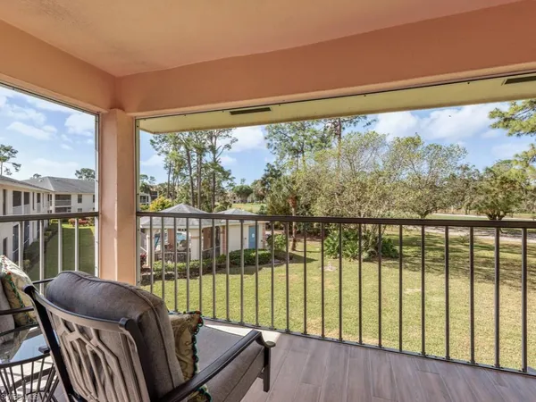 a view of balcony with furniture