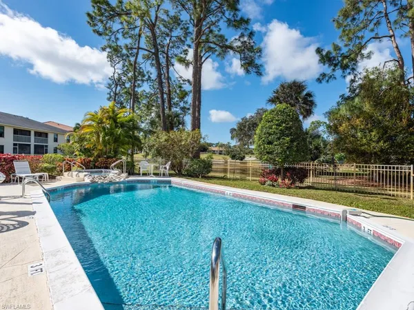 a view of swimming pool with chairs