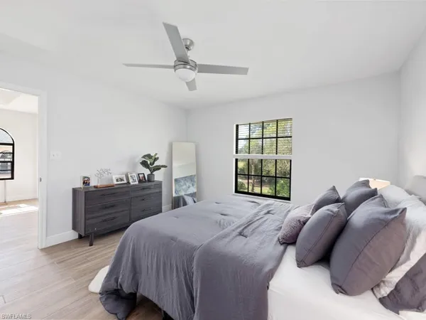 a bed room with a bed and a window