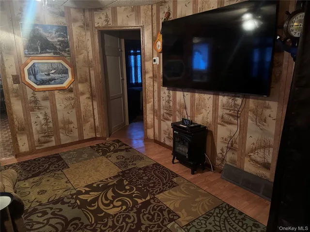 a living room with a couch and a stove